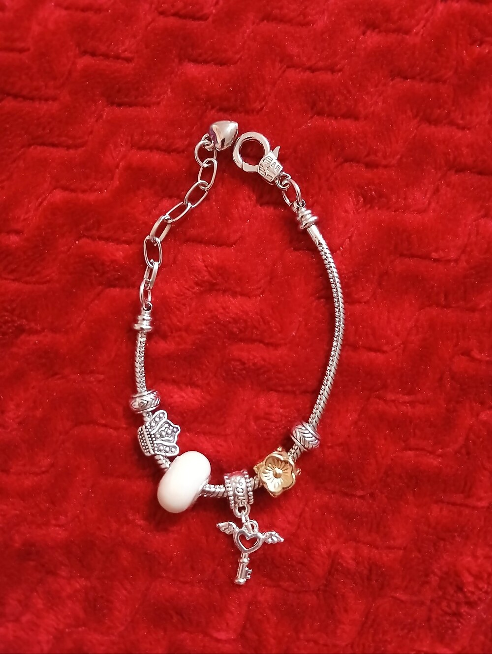 Sterling Silver Charm Bracelet with White and Gold Accents